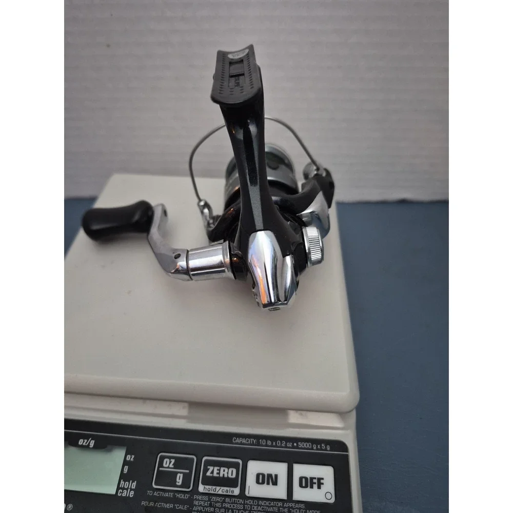 SHIMANO SIENNA 1000 FE SPINNIG REEL..LOOKS NEW BUT SELLING AS USED